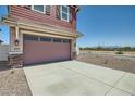 Two-car garage with stone accents and driveway at 3346 S 82Nd St, Mesa, AZ 85212