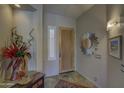 Bright and airy entryway with tile floors and unique decor at 6788 E Nightingale Star Cir, Scottsdale, AZ 85266