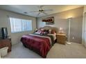 Cozy bedroom with a large window, ceiling fan, and ample natural light at 8260 E Keats Ave # 500, Mesa, AZ 85209