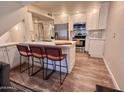 Modern kitchen with stainless steel appliances and island at 850 S River Dr # 1002, Tempe, AZ 85281