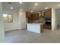 Modern kitchen with island and stainless steel appliances at 9221 E Sector Dr, Mesa, AZ 85212