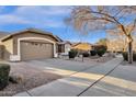 This single story home has a two car garage and a well maintained desert landscape at 924 S Evergreen St, Chandler, AZ 85225