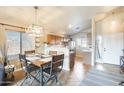 Cozy dining area adjacent to the kitchen with a rustic table and chairs at 9477 W Frank Ave, Peoria, AZ 85382