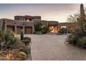 Stunning desert contemporary home with a large courtyard and three-car garage at 11077 E Cinder Cone Trl, Scottsdale, AZ 85262