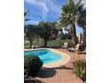 Relaxing pool area with patio furniture and a view of the golf course at 13248 N 12Th Pl, Phoenix, AZ 85022