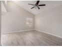 Living room featuring tile flooring, high ceiling, and a ceiling fan at 1342 W Emerald Ave # 344, Mesa, AZ 85202