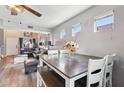 Dining area with a modern table and white chairs at 14885 W Caribbean Ln, Surprise, AZ 85379