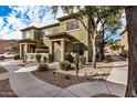 Charming townhome with desert landscaping, front gated entry, and sidewalk at 15240 N 142Nd Ave # 1149, Surprise, AZ 85379