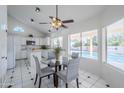 Eat-in kitchen boasting white cabinetry, updated appliances, and views of the outdoor pool at 15857 N 51St Pl, Scottsdale, AZ 85254