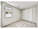 Cozy bedroom with neutral carpeting, a window, and a closet at 17299 W Desert Sage Dr, Goodyear, AZ 85338