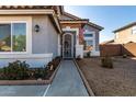 Inviting front entry featuring an ornate security door and well-manicured landscaping at 1937 W Burgess Ln, Phoenix, AZ 85041