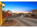 Long driveway with desert landscaping and ample space for multiple cars at 21284 W Hillcrest Blvd, Buckeye, AZ 85396