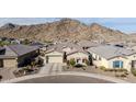 Stunning single-story home with mountain views, a two-car garage, and desert landscaping at 21284 W Hillcrest Blvd, Buckeye, AZ 85396