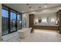 Luxurious bathroom with freestanding tub and glass shower at 24923 N 91 St, Scottsdale, AZ 85255