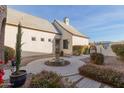 Private courtyard with fountain and lush landscaping at 2706 E Lovebird Ln, Gilbert, AZ 85297