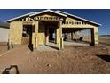 Exterior view of a home under construction, showing the framing and some plywood sheathing, and attached garage at 32693 N Newby Dr, San Tan Valley, AZ 85143