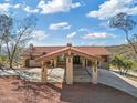 Front view of house with a porte cochere entrance during daytime at 37020 N 31St Ave, Phoenix, AZ 85086