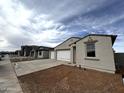 Charming new construction home featuring a three car garage and neutral stucco exterior at 4328 E Bradford Ave, San Tan Valley, AZ 85140