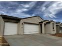 Charming single-story home featuring a three car garage and neutral stucco exterior at 4328 E Bradford Ave, San Tan Valley, AZ 85140