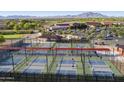 Aerial shot of pickleball courts with mountain views, offering an active lifestyle in a beautiful setting at 4439 E Ficus Way, Gilbert, AZ 85298