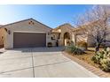 Spanish style home with a two car garage at 6615 W Sandpiper Ct, Florence, AZ 85132