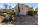 View of the side yard, with a large cactus at 6615 W Sandpiper Ct, Florence, AZ 85132