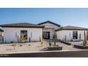 Modern home exterior with clean lines and desert landscaping at 7130 E Saddleback St # 11, Mesa, AZ 85207