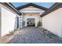 Elegant entryway with double doors and a paved walkway at 7130 E Saddleback St # 11, Mesa, AZ 85207