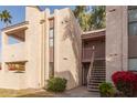 Condo building with stairs and flowering bushes at 7510 E Thomas Rd # 234, Scottsdale, AZ 85251