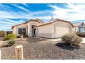 Charming single-story home featuring a two car garage and low maintenance front yard at 8553 N 112Th Ave, Peoria, AZ 85345