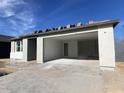 New construction home with gray exterior and a two-car garage at 9526 W Luxton Ln, Tolleson, AZ 85353