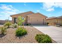 New construction home with a two-car garage and drought-tolerant landscaping at 961 W 20 Th St, Florence, AZ 85132