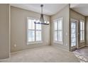 Cozy dining area with natural light streaming through shuttered windows at 14250 W Wigwam Blvd # 2822, Litchfield Park, AZ 85340