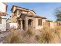 Two-story house with stone accents and desert landscaping at 17855 N 114Th Dr, Surprise, AZ 85378