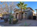 Charming two-story home with desert landscaping, stone accents, and a three-car garage at 17965 W Carol Ave, Waddell, AZ 85355
