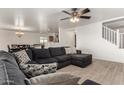 Spacious living room with L-shaped sofa and tile flooring at 18907 N Vemto St, Maricopa, AZ 85138