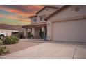 Charming two-story home with a well-maintained front yard and a three-car garage at 2073 E Wildhorse Dr, Chandler, AZ 85286