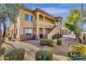 Inviting condo building featuring well-manicured landscaping and ample parking at 2134 E Broadway Rd # 2033, Tempe, AZ 85282