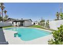 Backyard oasis with a refreshing pool and lush landscaping at 2217 N 79Th St, Scottsdale, AZ 85257