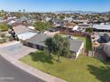 This beautiful house is a single-story home with a spacious backyard, and mature trees at 2527 N 69Th Pl, Scottsdale, AZ 85257