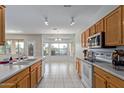 Kitchen features wood cabinets, stainless steel appliances, and an island at 3427 E Waterview Dr, Chandler, AZ 85249