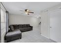 Living room with gray sectional sofa and tile floors at 625 S Westwood -- # 102, Mesa, AZ 85210