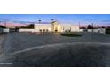 Expansive exterior shot showcases the home's architectural design, paved driveway, and landscaped front yard at 7860 E Davenport Dr, Scottsdale, AZ 85260