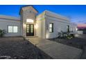 Stunning front entrance featuring stone accents and a paved walkway, exuding curb appeal at 7860 E Davenport Dr, Scottsdale, AZ 85260