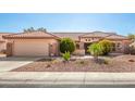 Inviting single story home with a well maintained yard and attached two car garage at 16331 W Willow Creek Ln, Surprise, AZ 85374