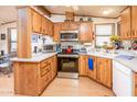 Galley kitchen with stainless steel appliances and wood cabinets at 1841 E Augusta Ave, Chandler, AZ 85249