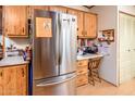 Stainless steel refrigerator and built-in workspace at 1841 E Augusta Ave, Chandler, AZ 85249