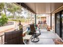 Covered patio with seating area overlooking a golf course at 1841 E Augusta Ave, Chandler, AZ 85249