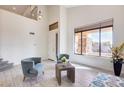 Bright living room with two comfy armchairs and large window at 22432 N 48Th St, Phoenix, AZ 85054