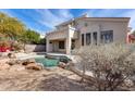 Relaxing backyard oasis with a sparkling pool and rock accents at 22432 N 48Th St, Phoenix, AZ 85054